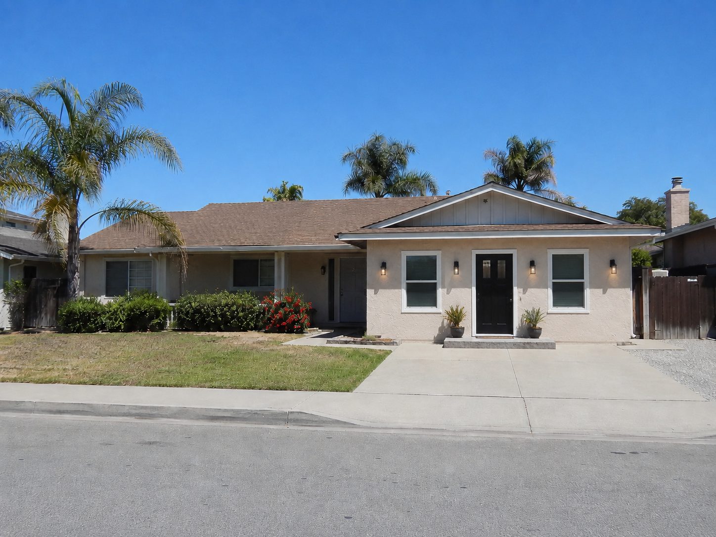The same elevation with the garage door replaced by a black entry door, two windows, wall sconces, and a step up entry