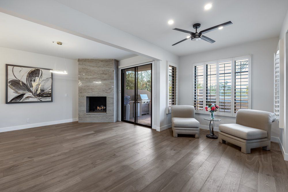 Living room with fireplace and sliding doors to the yard, remodeled by Dreamliner Construction