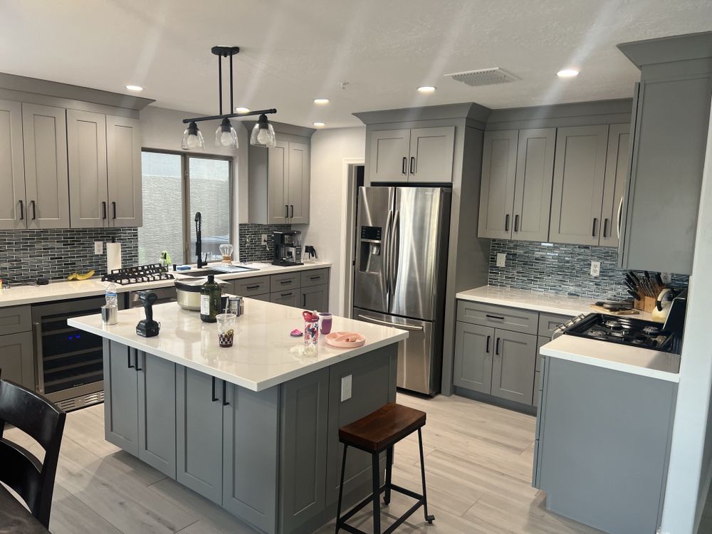 Kitchen island and lighting by Dreamliner Construction